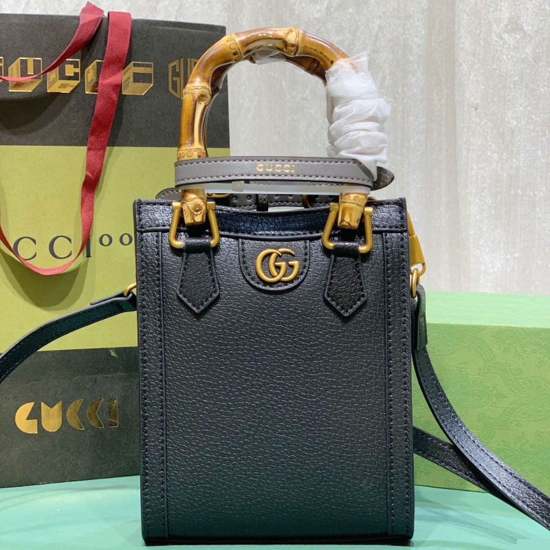 G*u*i top handle bags